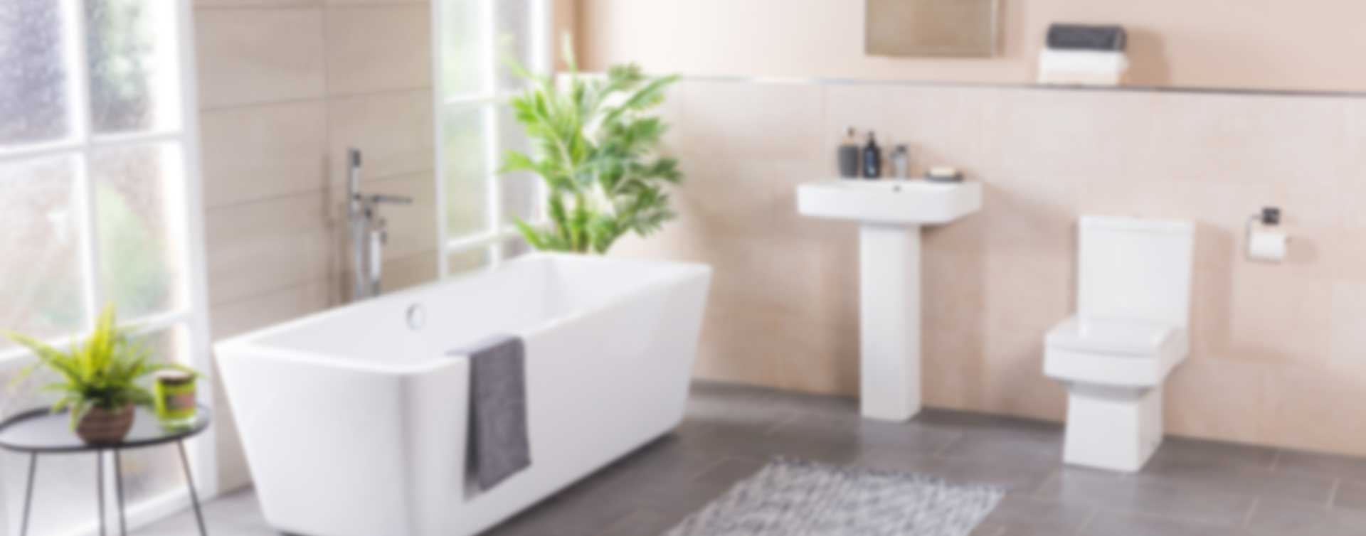 Hotel bathroom with towels, soap dispenser and bathroom accessories